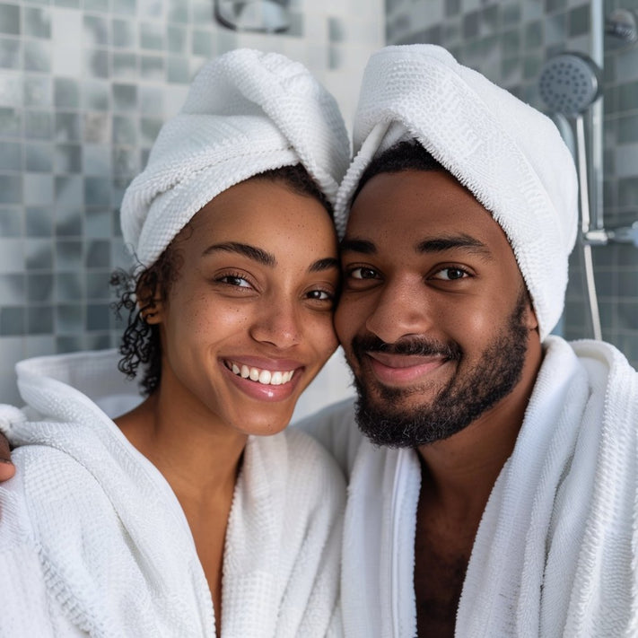 woman melanated skin using body cream